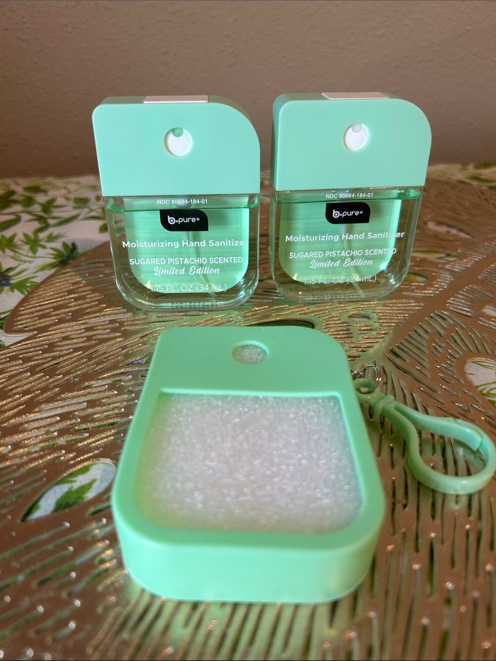 Hand sanitizer sugared pistachio. Includes case/keychain.